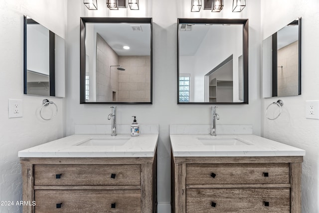 full bath featuring two vanities and a sink