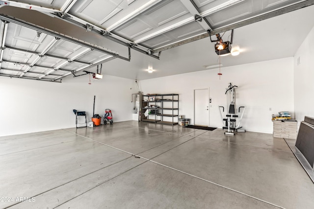 garage featuring a garage door opener and gas water heater