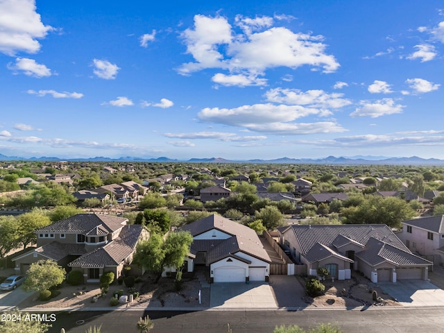 drone / aerial view featuring a mountain view and a residential view