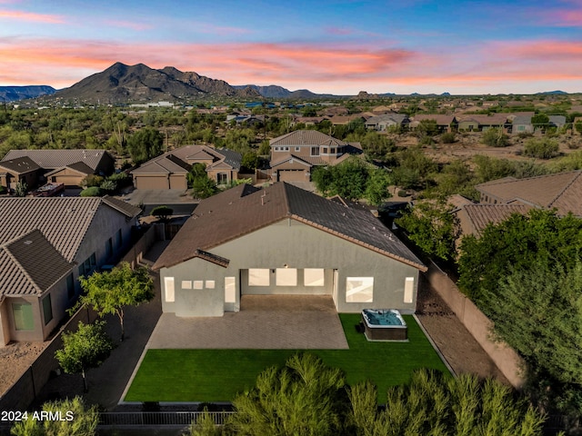 birds eye view of property with a residential view and a mountain view