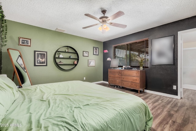 20053 N 15th Dr, Phoenix, AZ 85027 - bedroom with a ceiling fan, a textured ceiling, baseboards, and wood finished floors
