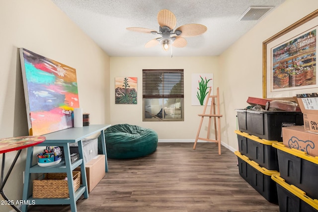20053 N 15th Dr, Phoenix, AZ 85027 - recreation room featuring a textured ceiling, visible vents, baseboards, wood finished floors, and a ceiling fan