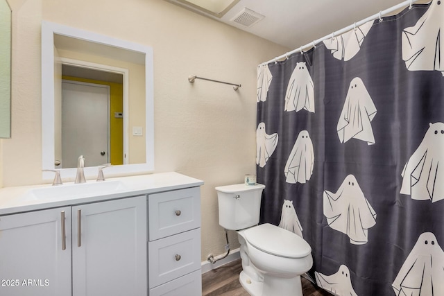 20053 N 15th Dr, Phoenix, AZ 85027 - full bathroom with vanity, toilet, visible vents, curtained shower, and wood finished floors