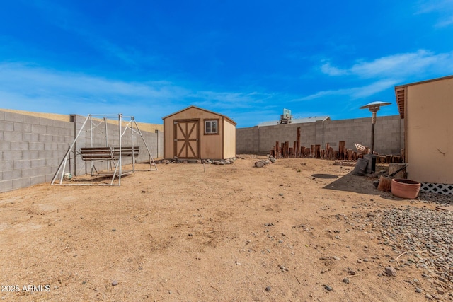 20053 N 15th Dr, Phoenix, AZ 85027 - view of yard featuring an outdoor structure, a fenced backyard, and a storage shed