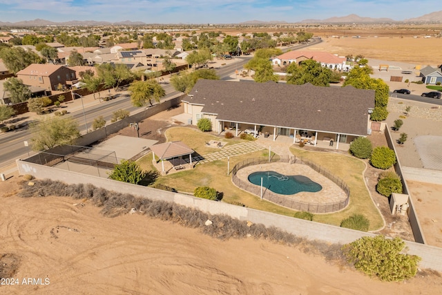 birds eye view of property with a mountain view