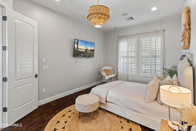 bedroom with dark hardwood / wood-style flooring