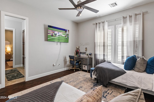 bedroom with ceiling fan and wood-type flooring