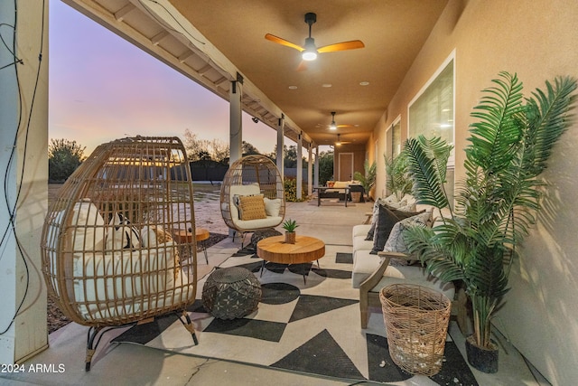 patio terrace at dusk with ceiling fan