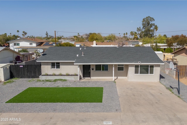 ranch-style home with fence, a gate, and stucco siding