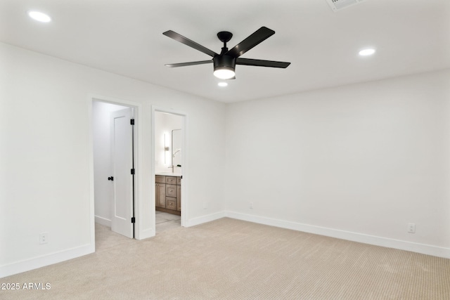 6761 E Juniper Ave, Scottsdale, AZ 85254 - unfurnished bedroom with light colored carpet, baseboards, ensuite bathroom, and recessed lighting