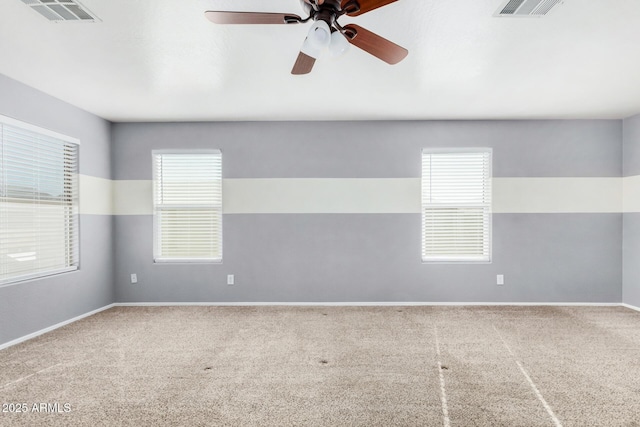 empty room featuring carpet flooring and ceiling fan