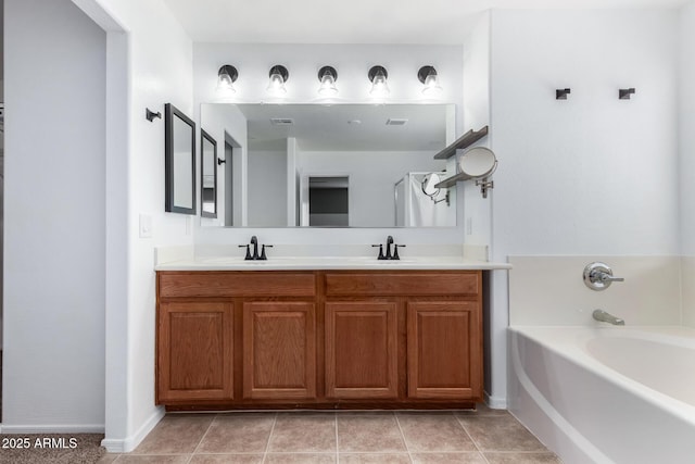 bathroom with vanity, a bath, and tile patterned floors