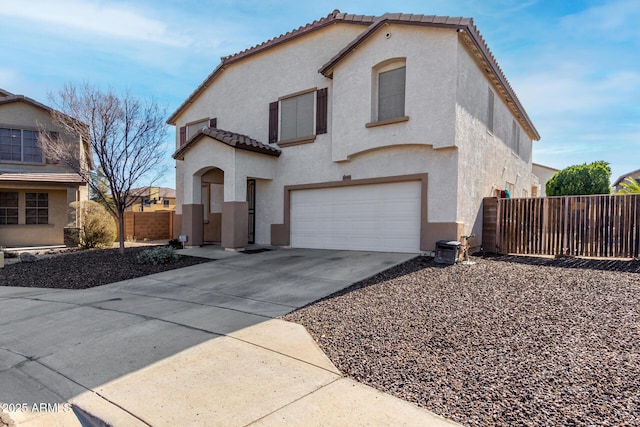 mediterranean / spanish-style house with a garage