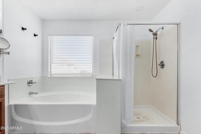 bathroom with vanity and plus walk in shower