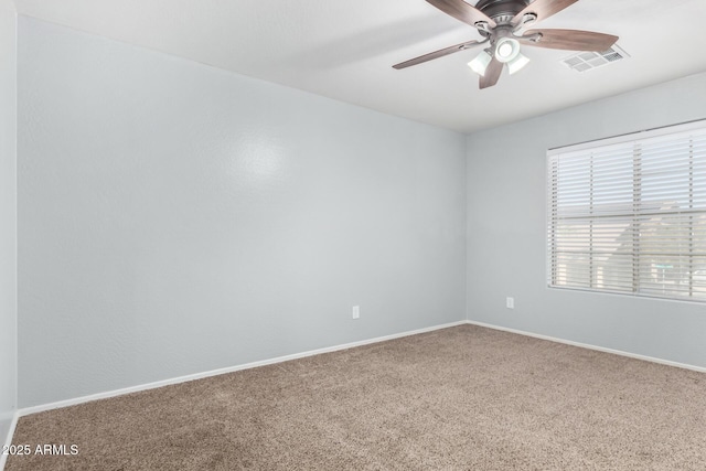 carpeted empty room featuring ceiling fan