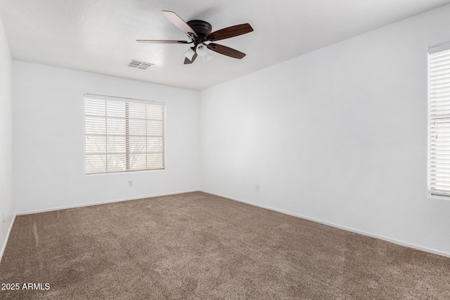 carpeted empty room with ceiling fan