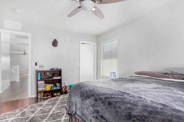 bedroom featuring dark hardwood / wood-style floors and ceiling fan