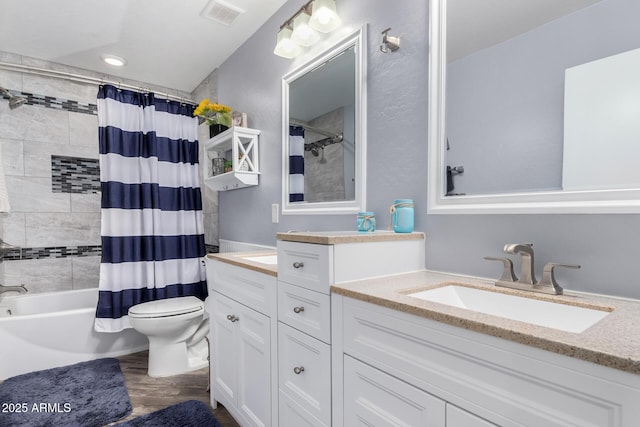 full bathroom with wood-type flooring, toilet, shower / bath combo with shower curtain, and vanity