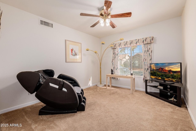 interior space with light colored carpet and ceiling fan