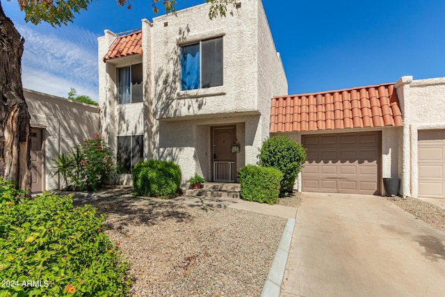 view of front of property with a garage