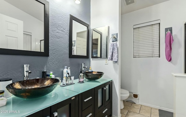 bathroom with tile patterned floors, toilet, and vanity