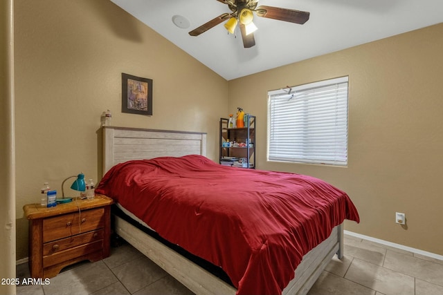 tiled bedroom featuring ceiling fan and lofted ceiling