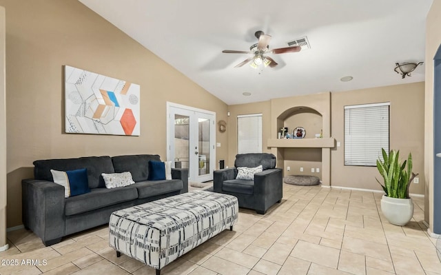 tiled living room featuring vaulted ceiling, french doors, and ceiling fan