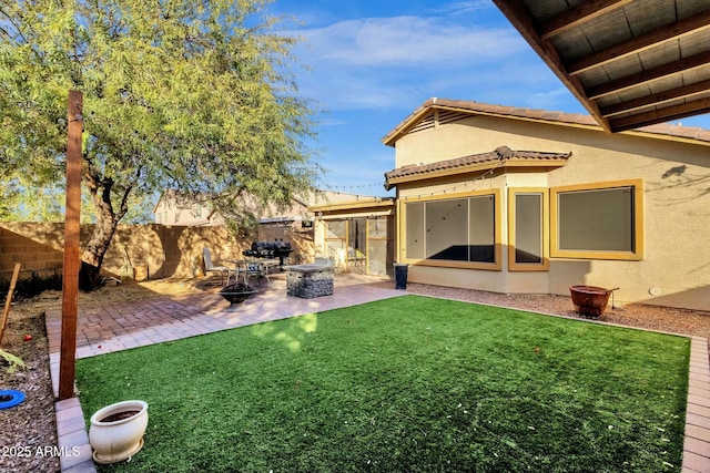 view of yard with a fire pit and a patio