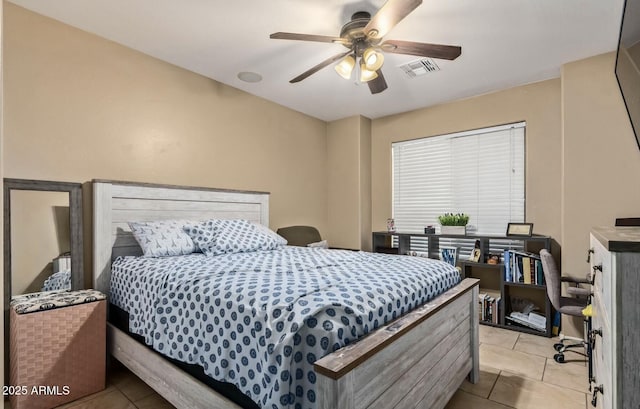 tiled bedroom with ceiling fan