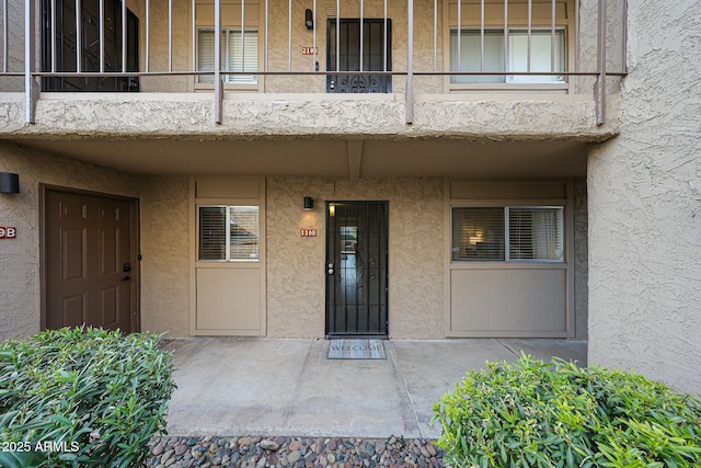 doorway to property featuring a balcony