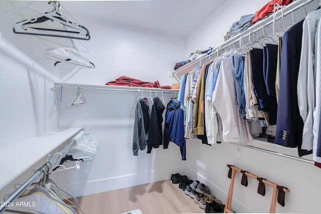 spacious closet featuring hardwood / wood-style floors