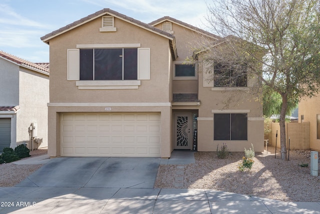 view of front of home with a garage