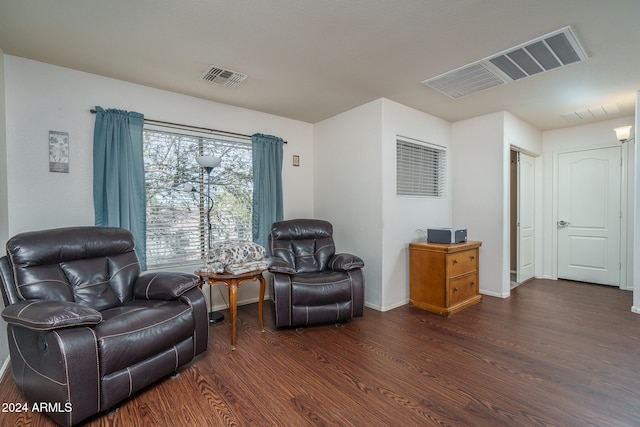 sitting room featuring dark hardwood / wood-style floors