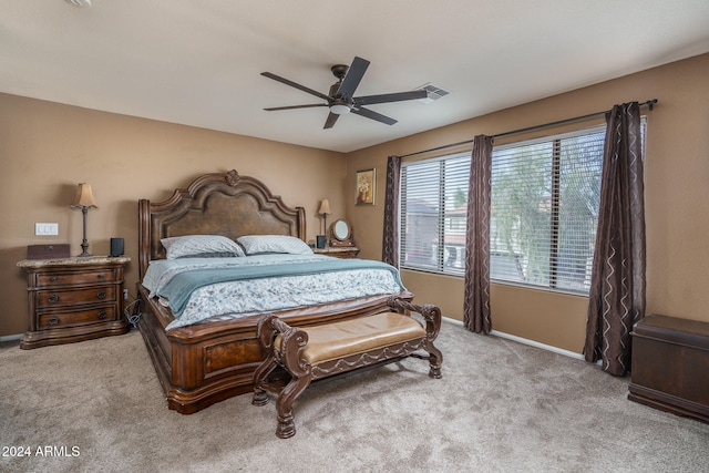 bedroom with light carpet and ceiling fan