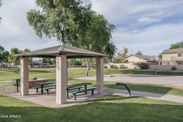 surrounding community featuring a gazebo and a lawn