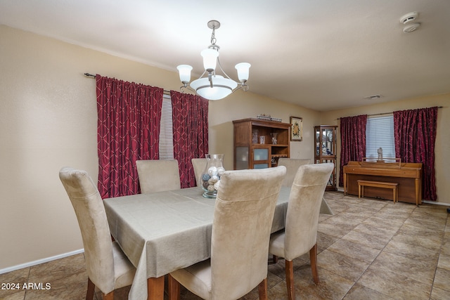 dining space with a chandelier