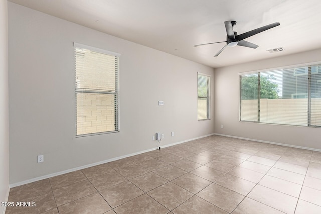 4051 E Torrey Pines Ln E, Chandler, AZ 85249 - empty room featuring light tile patterned flooring and ceiling fan