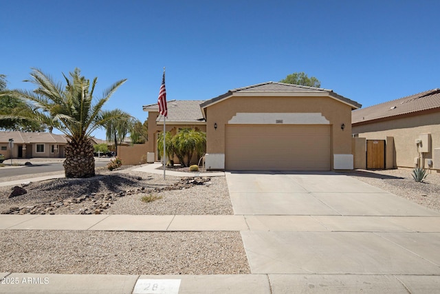 2861 E Morenci Rd, San Tan Valley, AZ 85143 - view of front of property featuring a garage, stucco siding, a tile roof, and concrete driveway