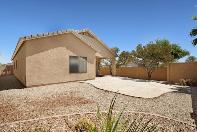 2861 E Morenci Rd, San Tan Valley, AZ 85143 - back of house with stucco siding, a patio, and a fenced backyard