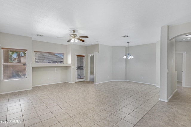 2861 E Morenci Rd, San Tan Valley, AZ 85143 - unfurnished living room featuring a ceiling fan, arched walkways, light tile patterned floors, and a chandelier