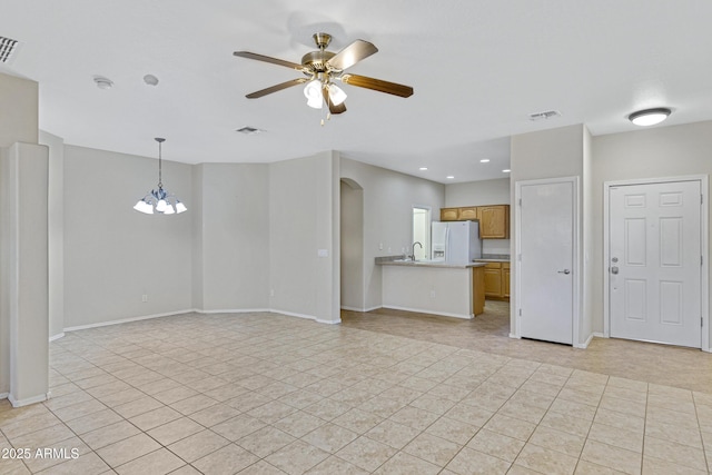 2861 E Morenci Rd, San Tan Valley, AZ 85143 - unfurnished living room with arched walkways, a ceiling fan, light tile patterned floors, a chandelier, and recessed lighting