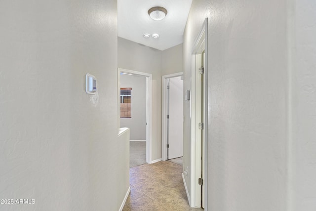 2861 E Morenci Rd, San Tan Valley, AZ 85143 - hallway featuring light tile patterned flooring and baseboards