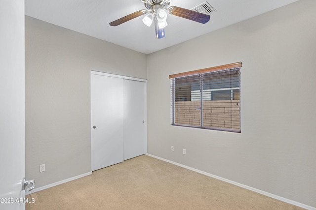 2861 E Morenci Rd, San Tan Valley, AZ 85143 - unfurnished bedroom with carpet, a closet, and a ceiling fan