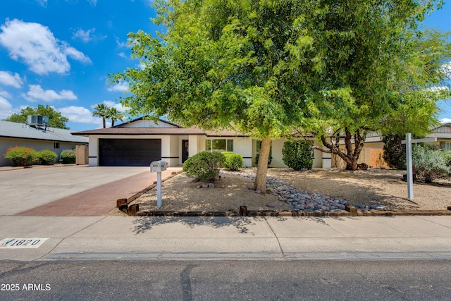 1820 W Seldon Way, Phoenix, AZ 85021 - ranch-style house featuring an attached garage, driveway, central AC unit, and stucco siding