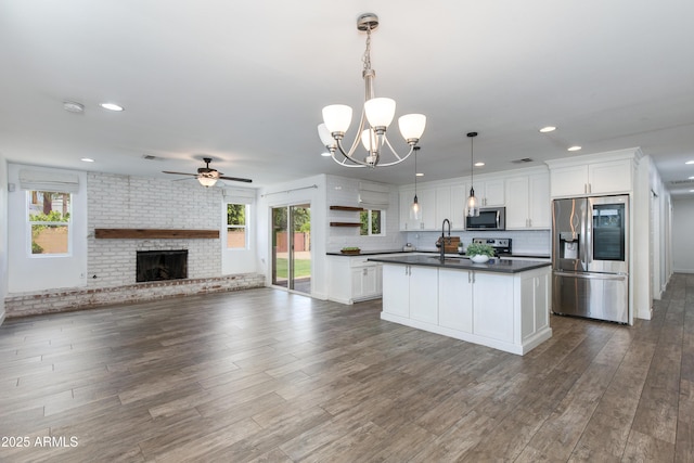 1820 W Seldon Way, Phoenix, AZ 85021 - kitchen featuring appliances with stainless steel finishes, dark countertops, a sink, healthy amount of natural light, and recessed lighting