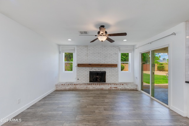 1820 W Seldon Way, Phoenix, AZ 85021 - unfurnished living room with ceiling fan, wood finished floors, a fireplace, baseboards, and recessed lighting