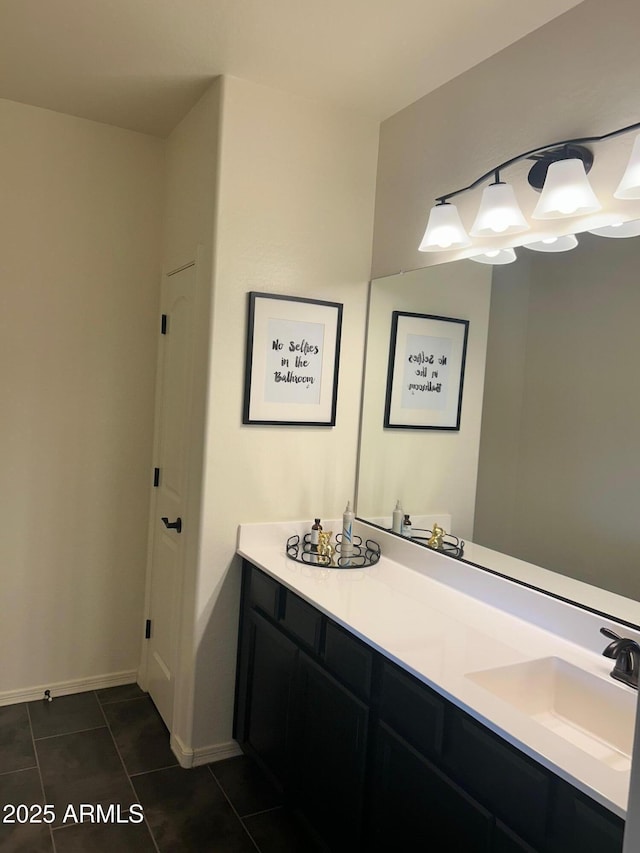 bathroom with tile patterned flooring and vanity