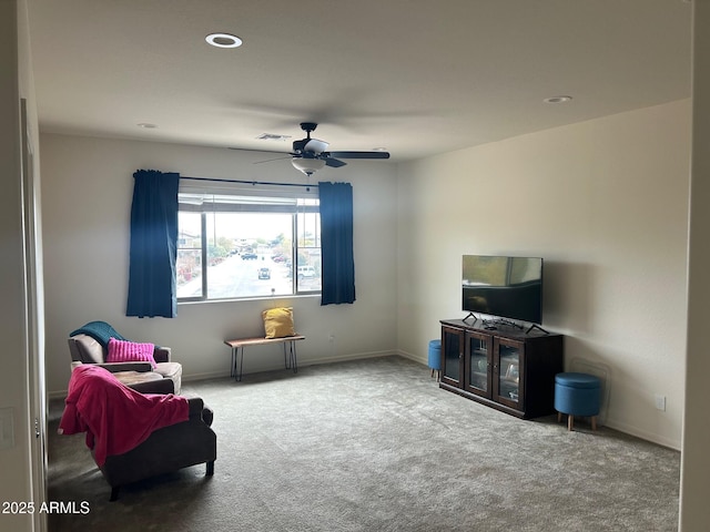 sitting room featuring ceiling fan and carpet flooring