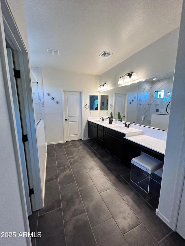 bathroom with vanity and tile patterned floors