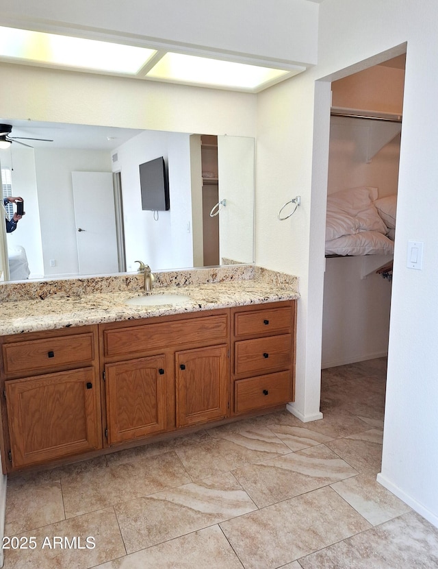 bathroom featuring vanity and ceiling fan